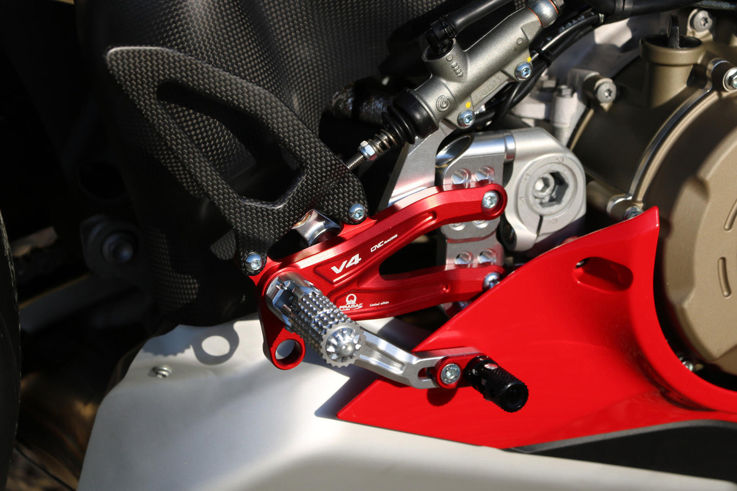 CNC Racing PRAMAC RACING LIMITED EDITION RPS Adjustable Rearset for the Ducati Panigale V4 / S / R - with Carbon Heel guard