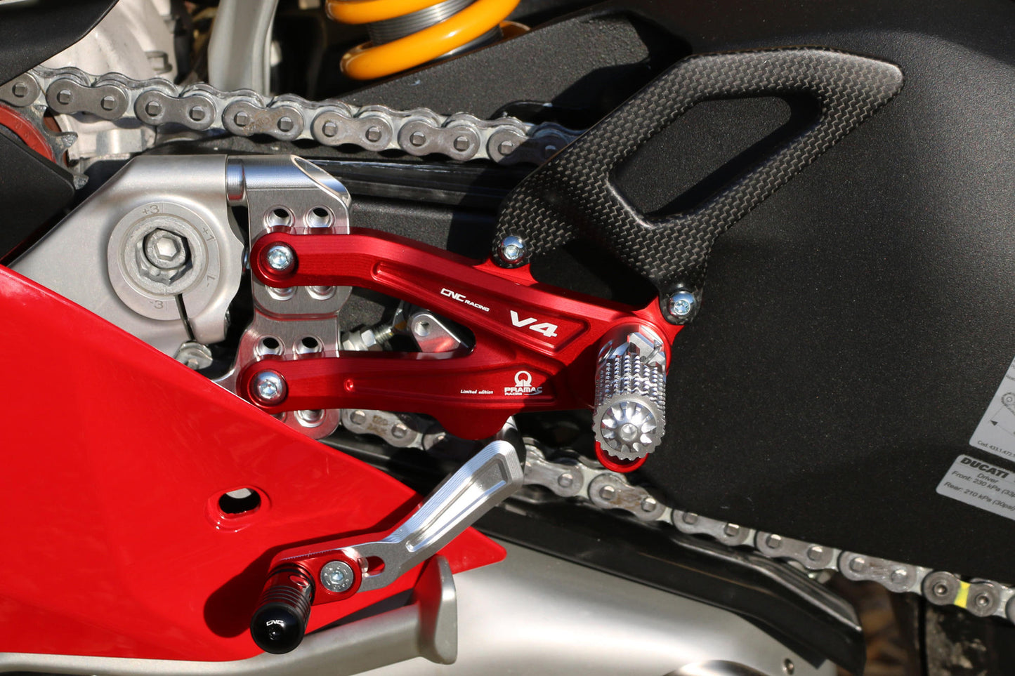 CNC Racing PRAMAC RACING LIMITED EDITION RPS Adjustable Rearset for the Ducati Panigale V4 / S / R - with Carbon Heel guard