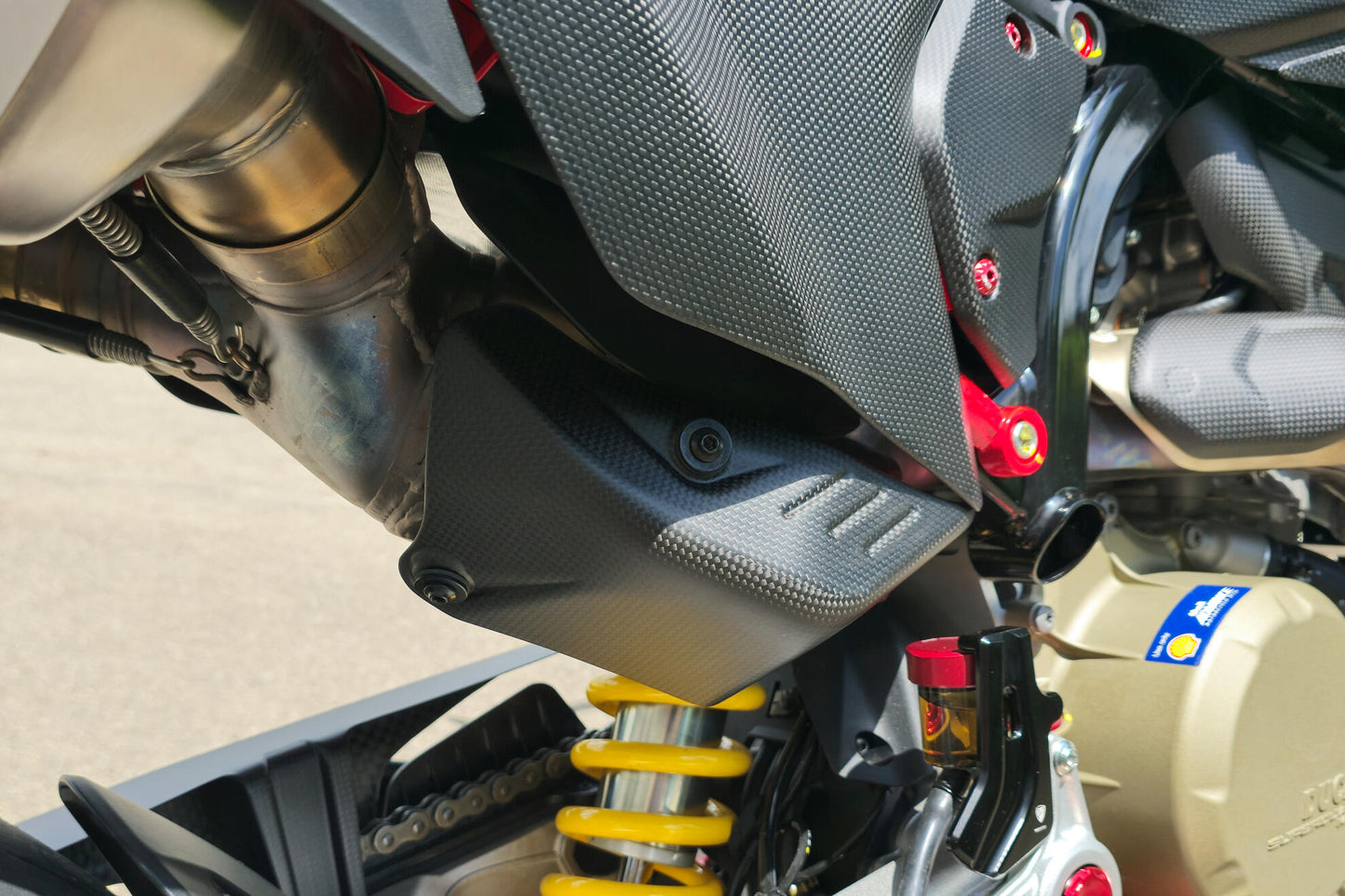 CNC Racing Carbon Fiber Rear Exhaust Guard for the Ducati Hypermotard 698 Mono